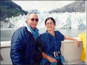 Martha and Rick on the water in front of a glacier